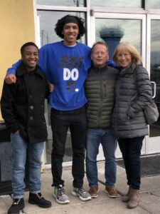 Four people standing outside
