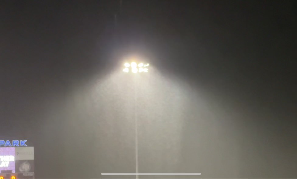 Rain falling on a baseball diamond