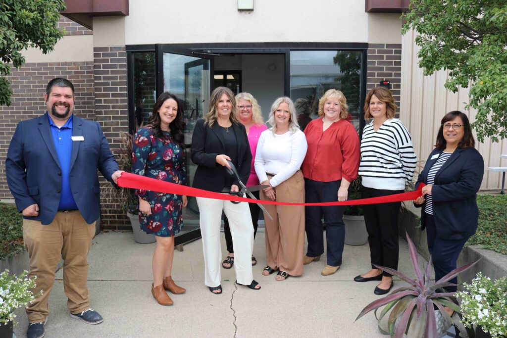 Small group outside for a ribbon cutting