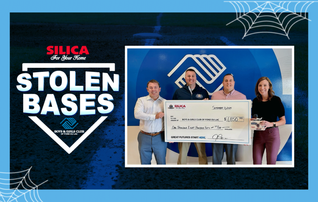 Four people holding a big check with a stolen bases logo