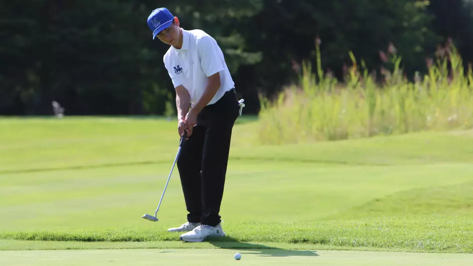 A man playing golf