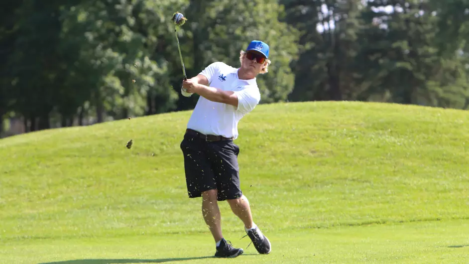 A man playing golf