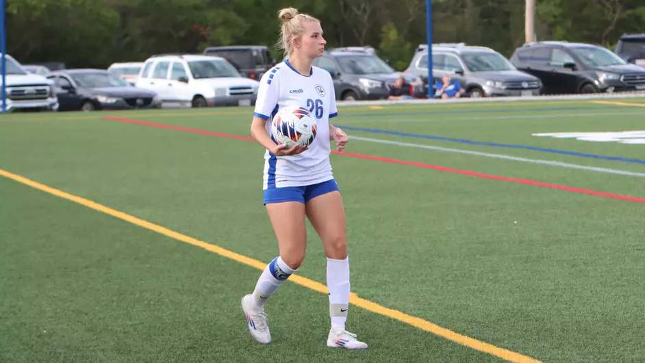A woman playing soccer