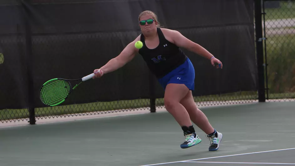 A woman playing tennis
