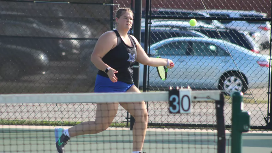 A woman playing tennis