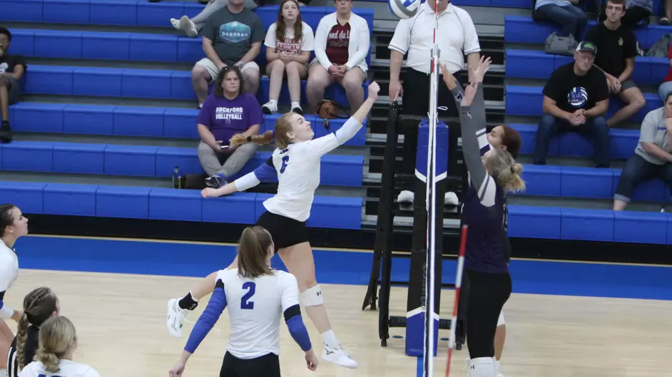 Women playing volleyball