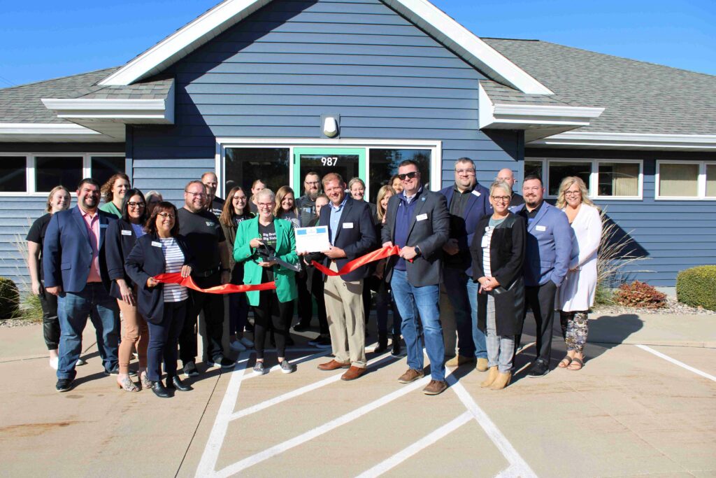 Large group outside for a ribbon cutting