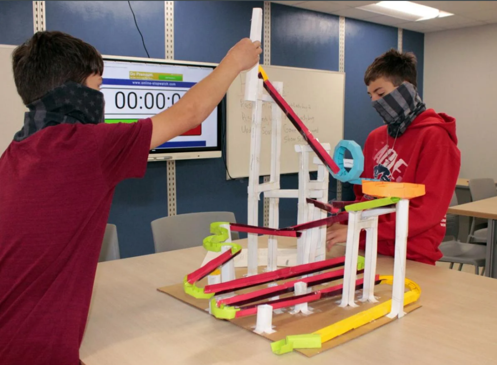Two students with an experiment