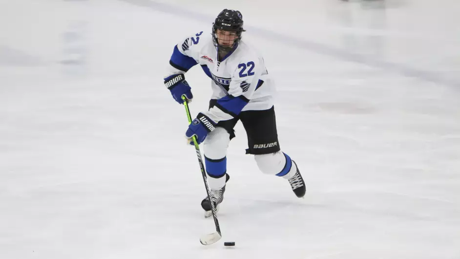 A man playing college hockey