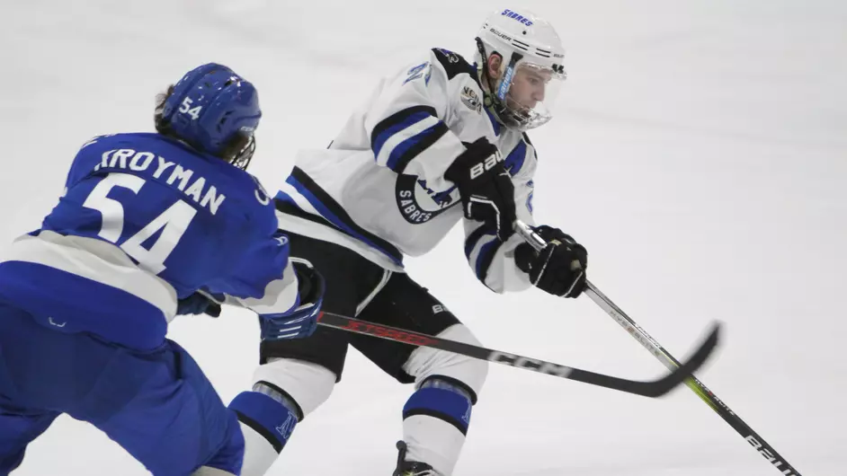 Men playing college hockey
