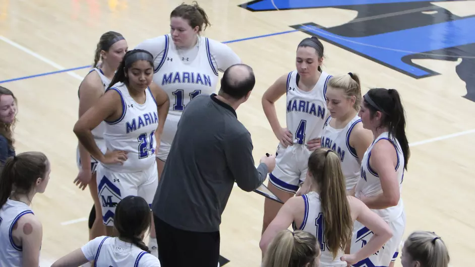 Women playing college basketball