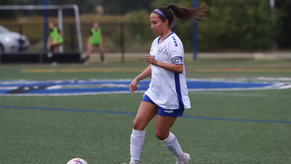 A woman playing soccer