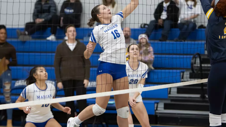 women playing college volleyball