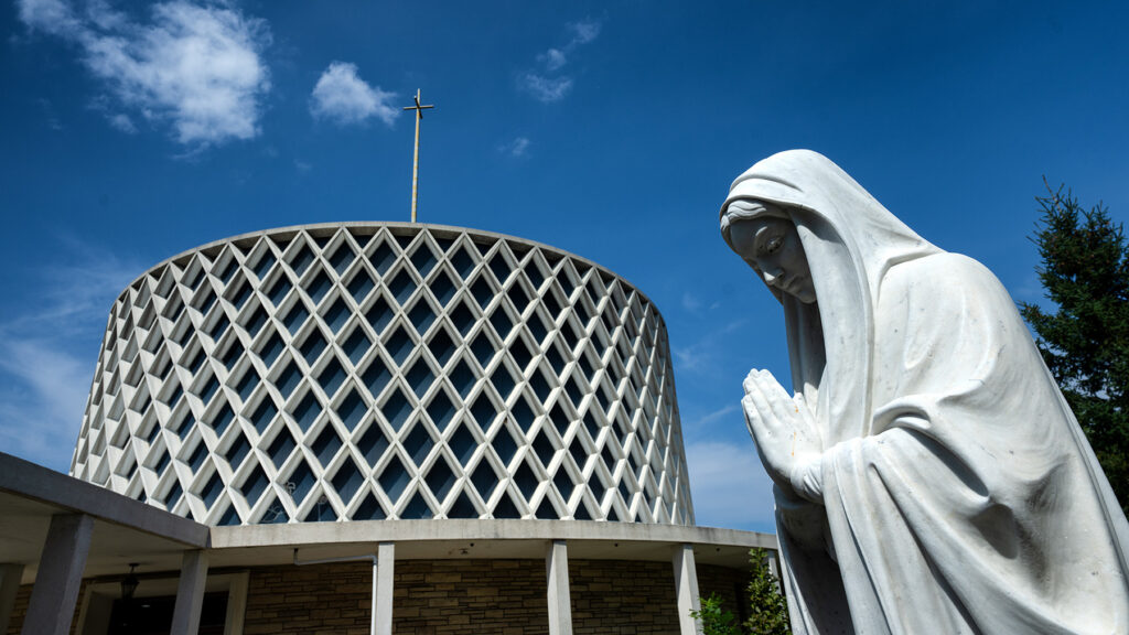 A chapel and a white statue