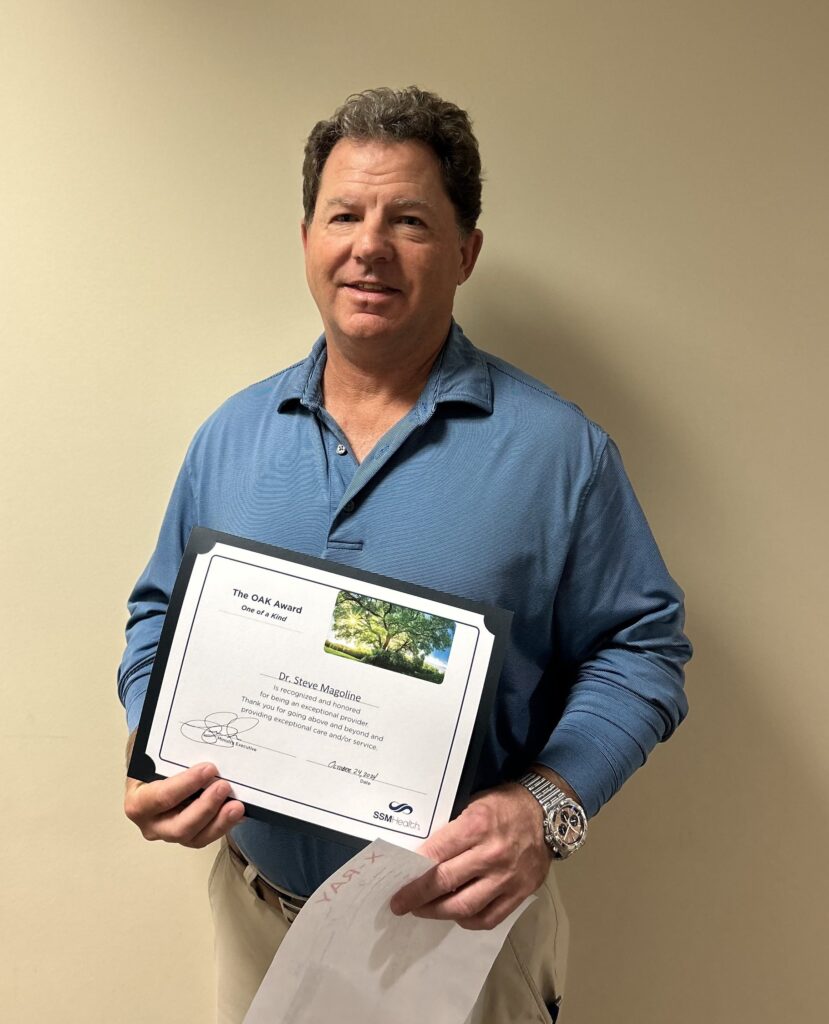 A man holding a certificate