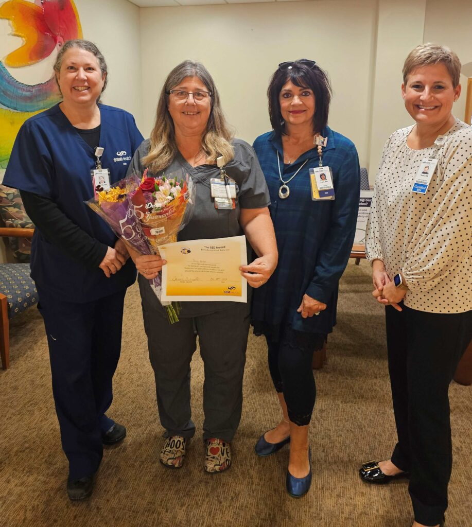 Four woman with a certificate