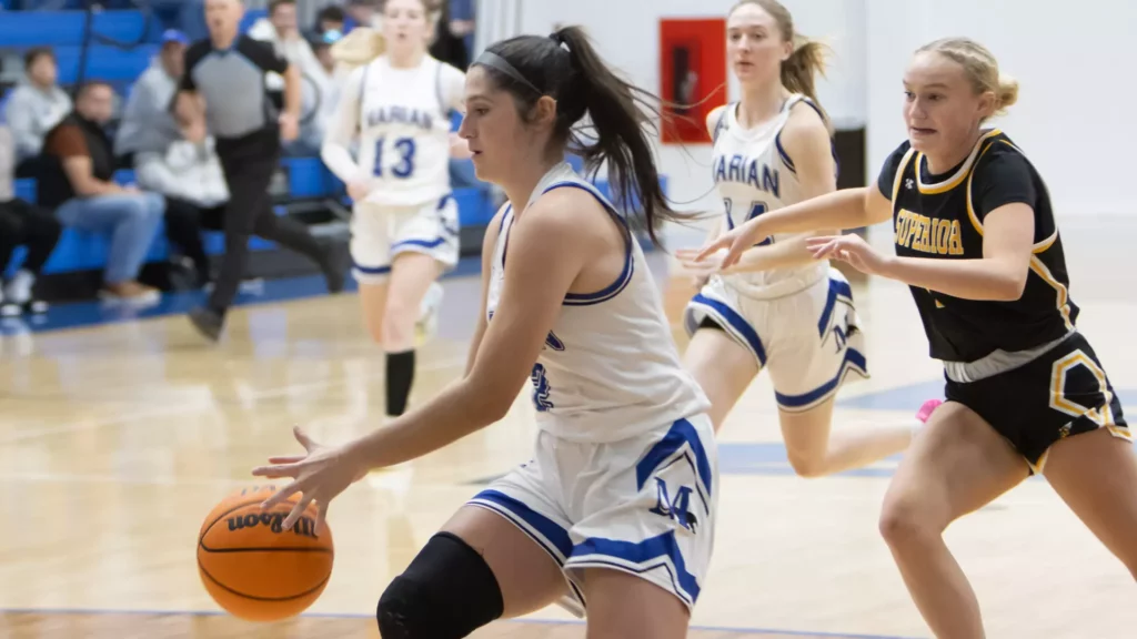 women playing college basketball