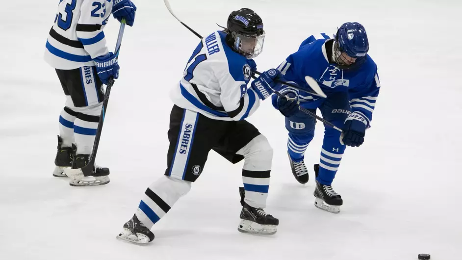 Women playing college hockey
