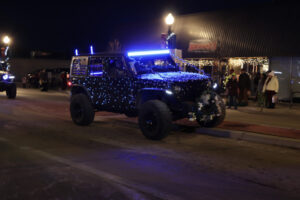 A Jeep lit up for a parade