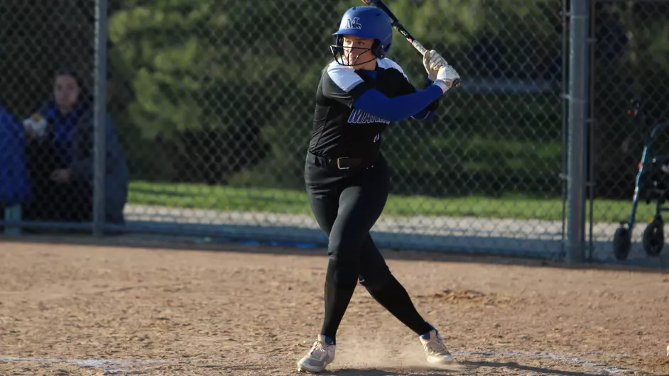 A woman playing college softball