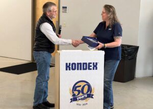 A man and a woman at a podium