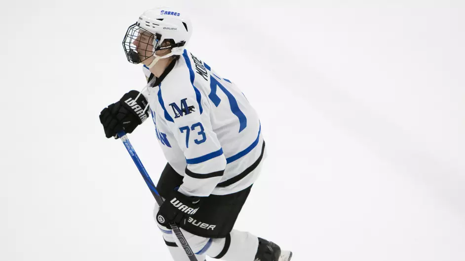 A man playing college hockey