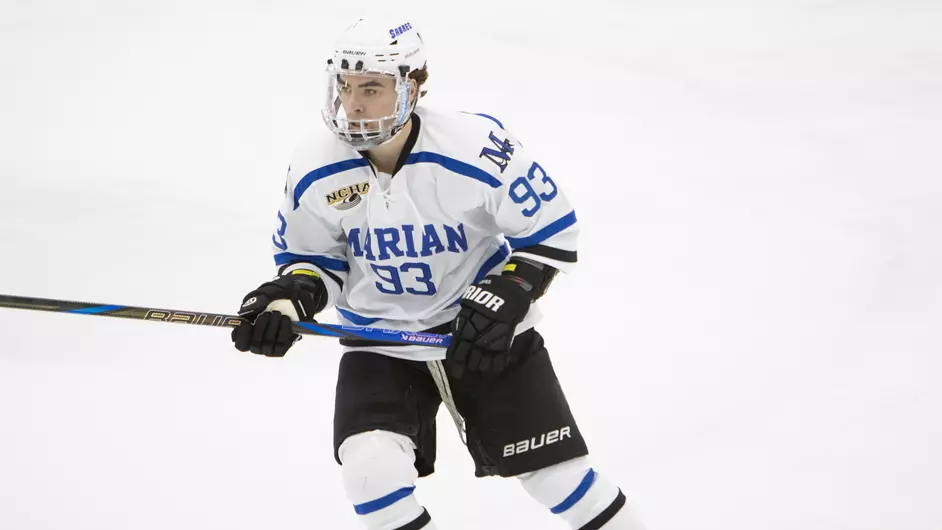 A man playing college hockey