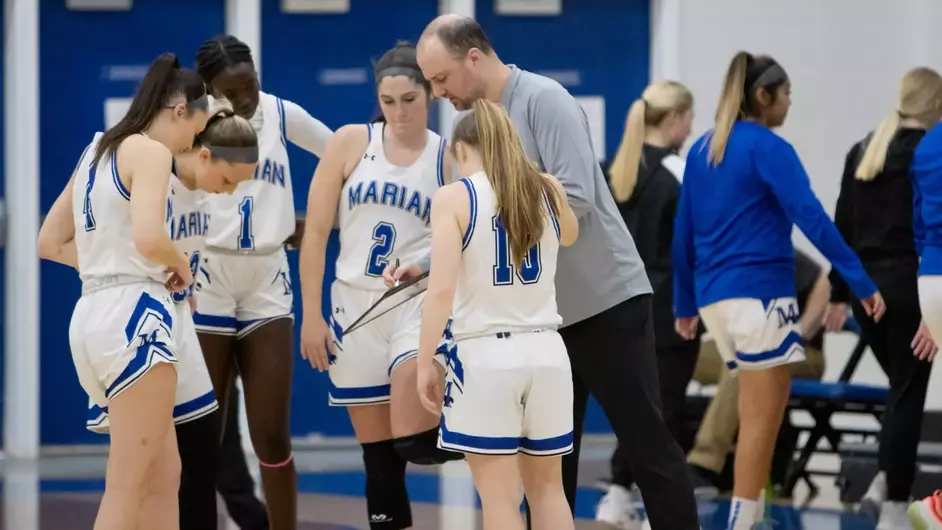 Women playing college basketball