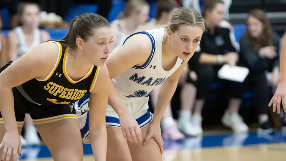 Women playing college basketball
