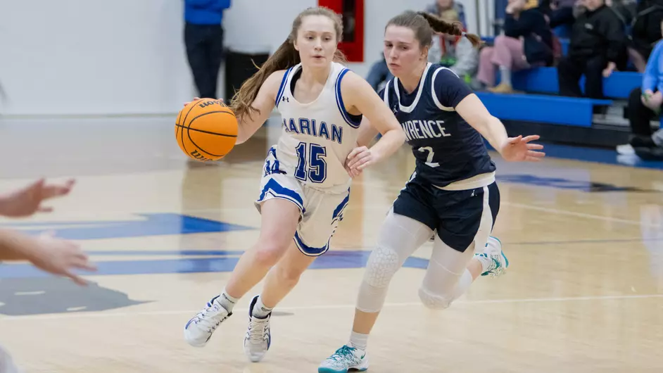 Women playing college basketball
