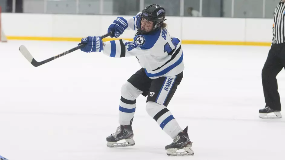 Women playing college hockey