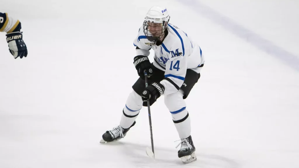 A man playing college hockey