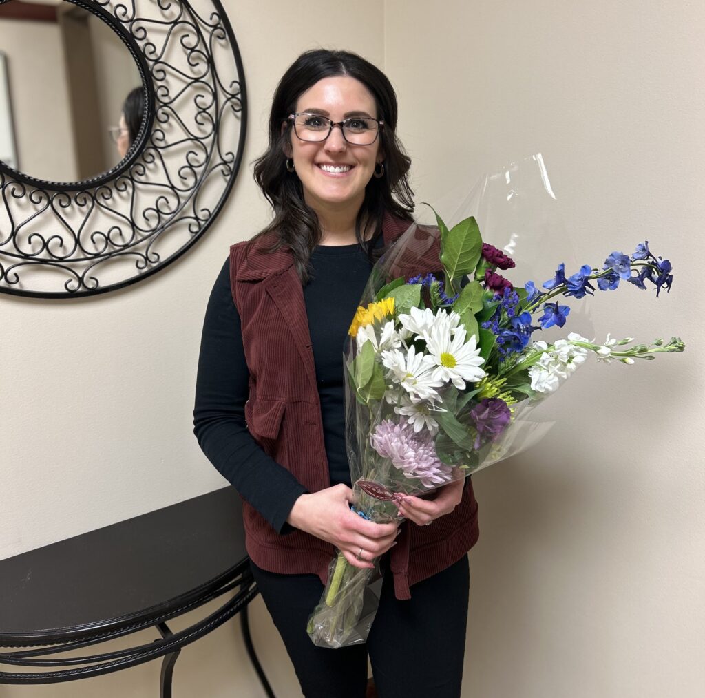 A woman holding flowers