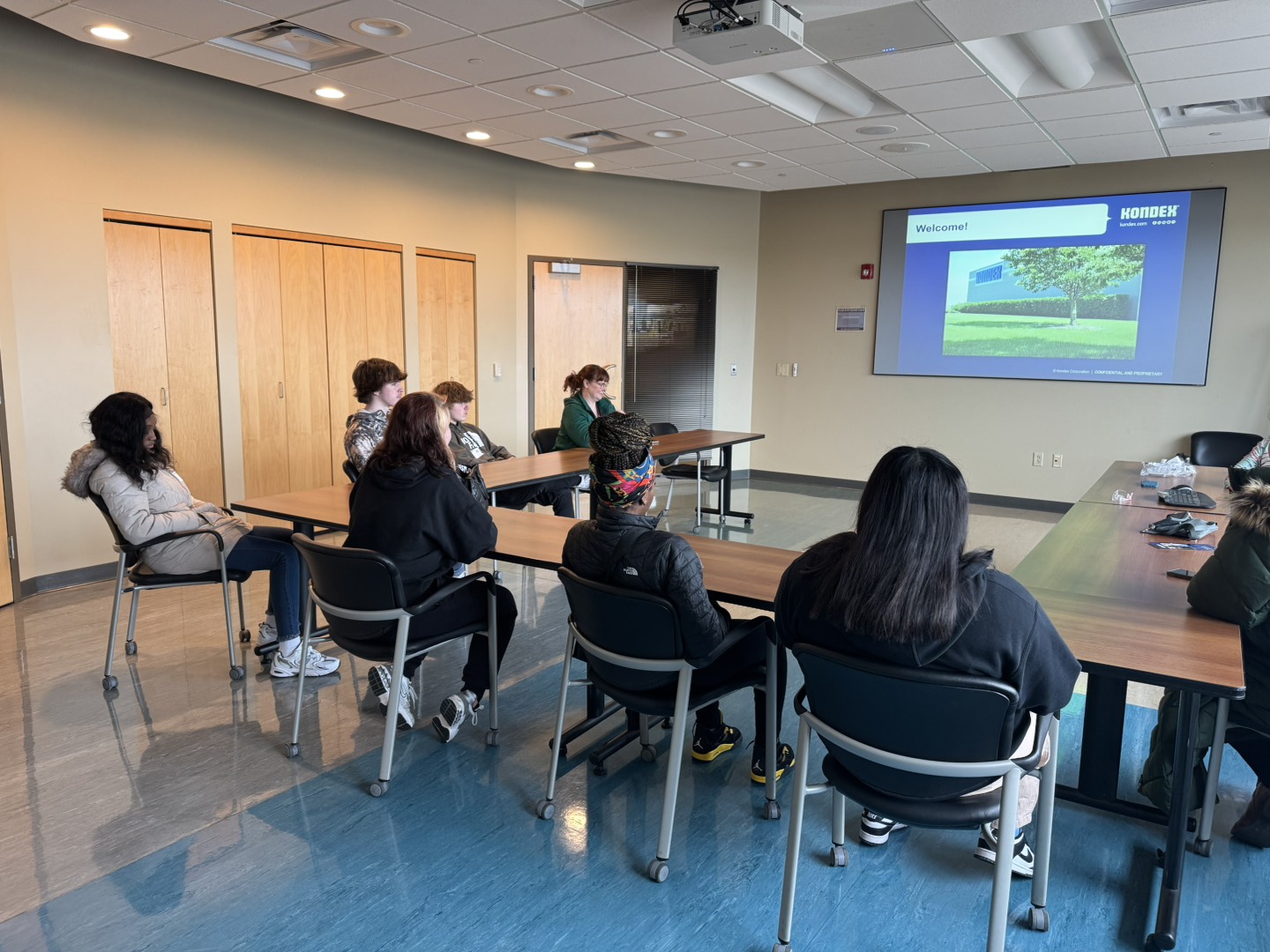 Students sitting listening to a presentation