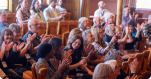 A crowd applauding