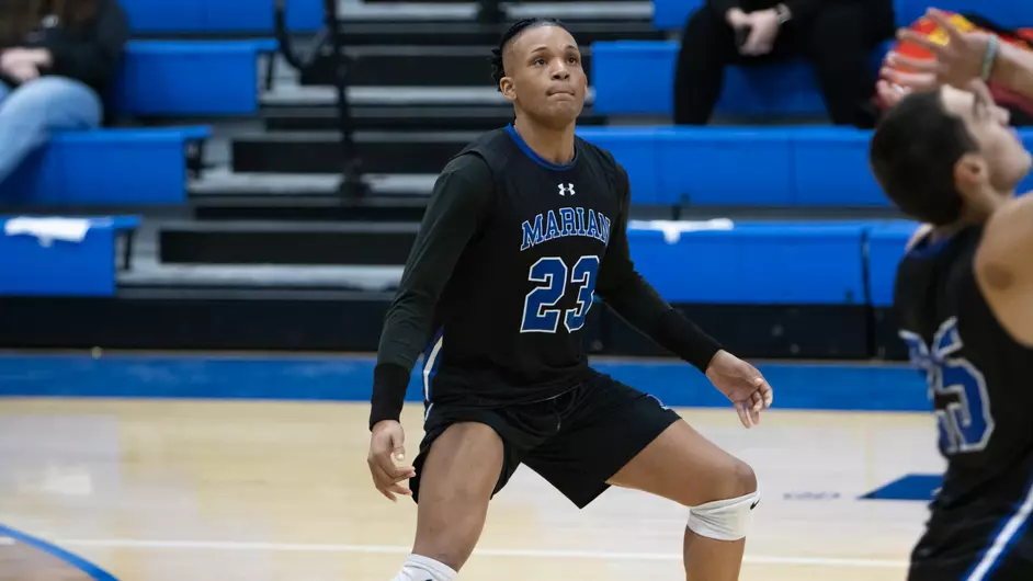 men playing college volleyball