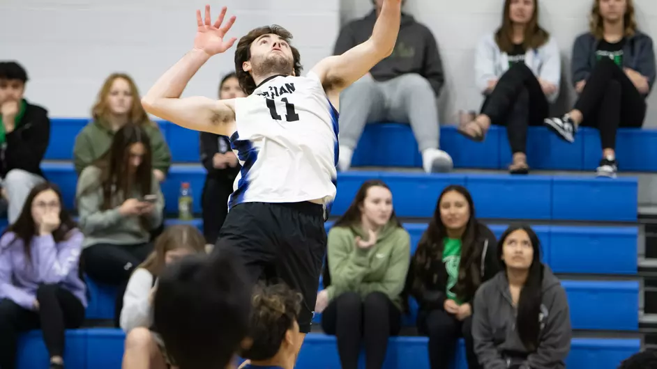 men playing college volleyball