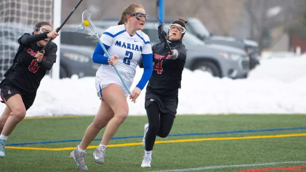 women playing college lacrosse