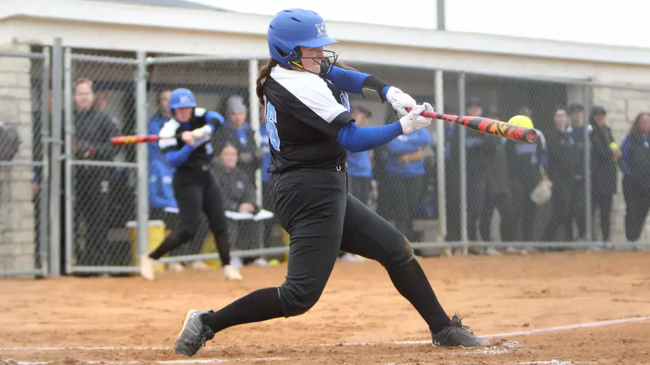 A woman playing college softball