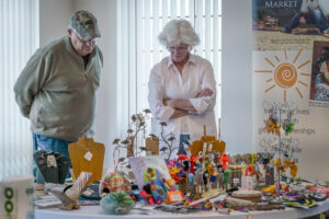 Two people looking at a table display