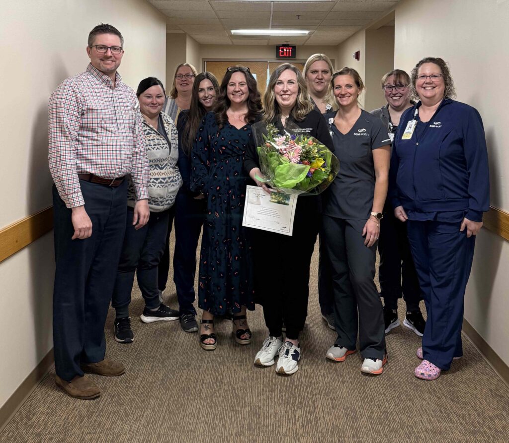 A group of people in a hospital hallway