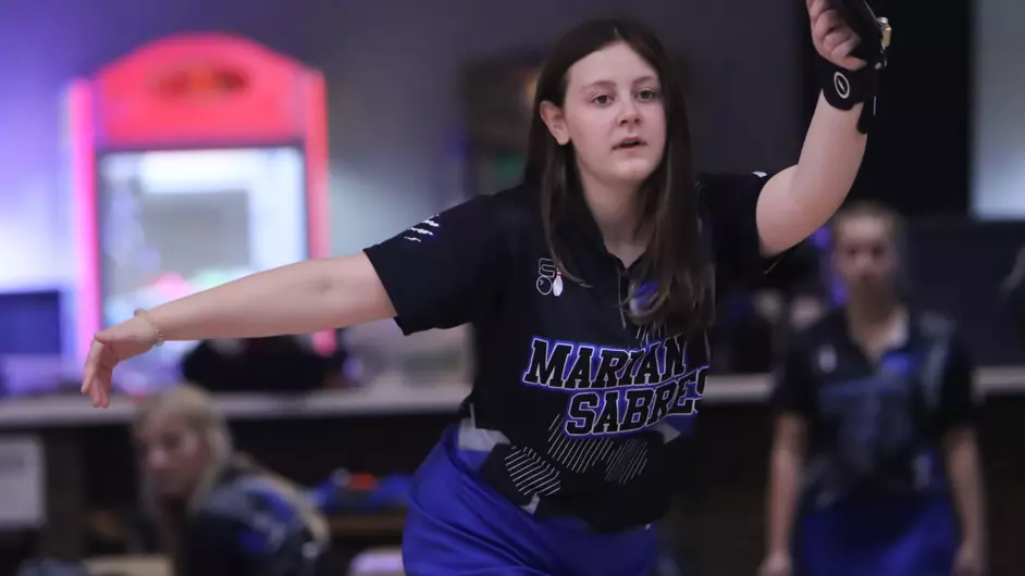A woman bowling for college