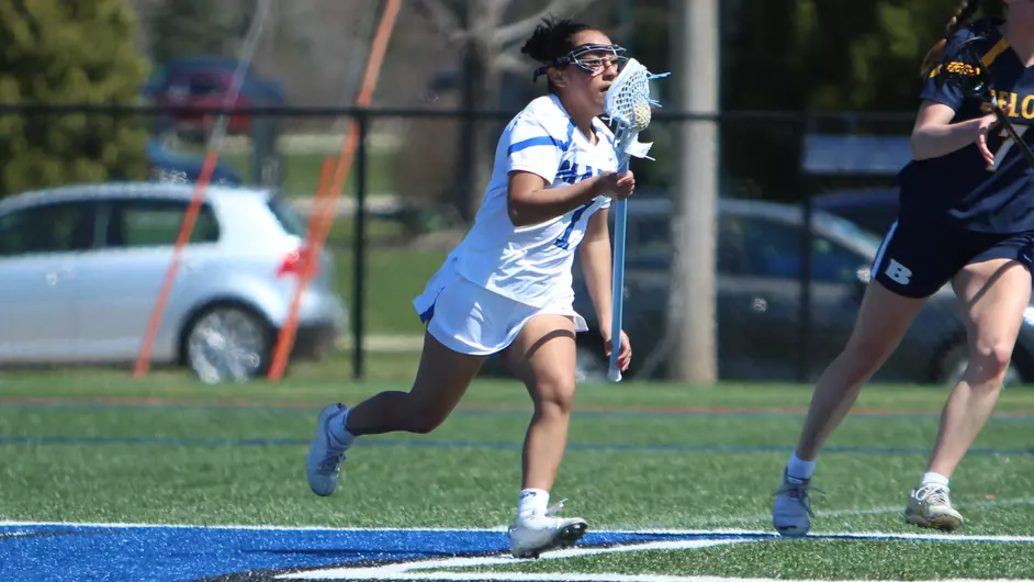 women playing college lacrosse