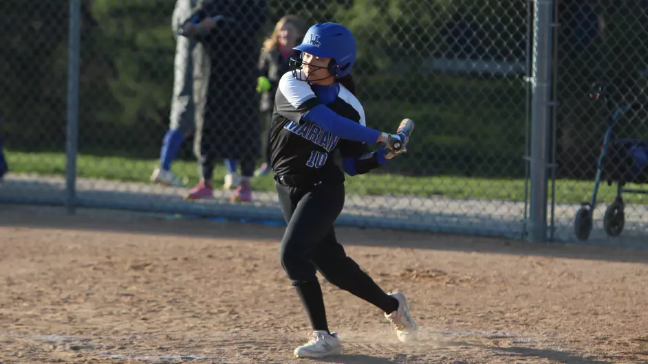 Women playing college softball