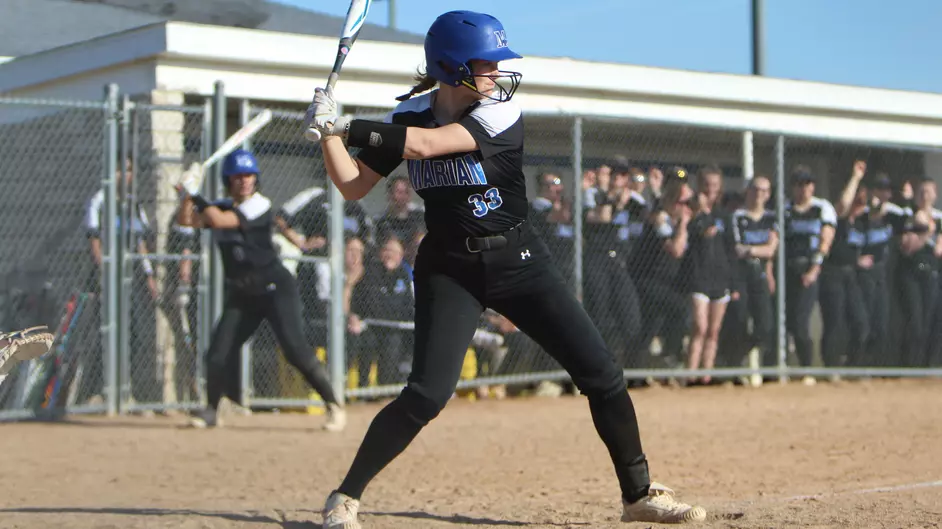 women playing college softball
