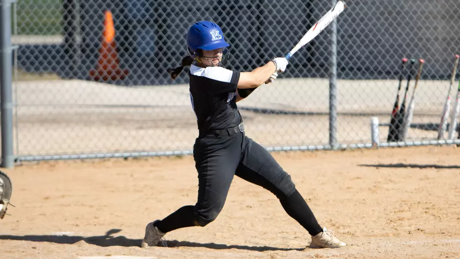 A woman playing college softball