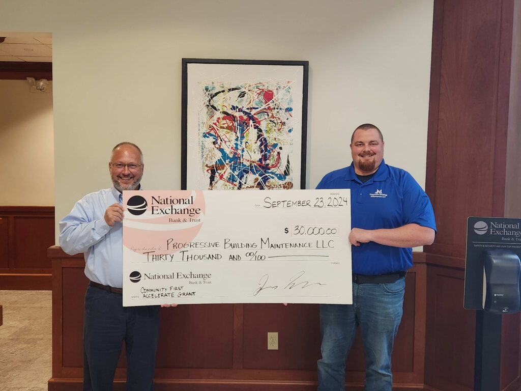 Two men with a big check