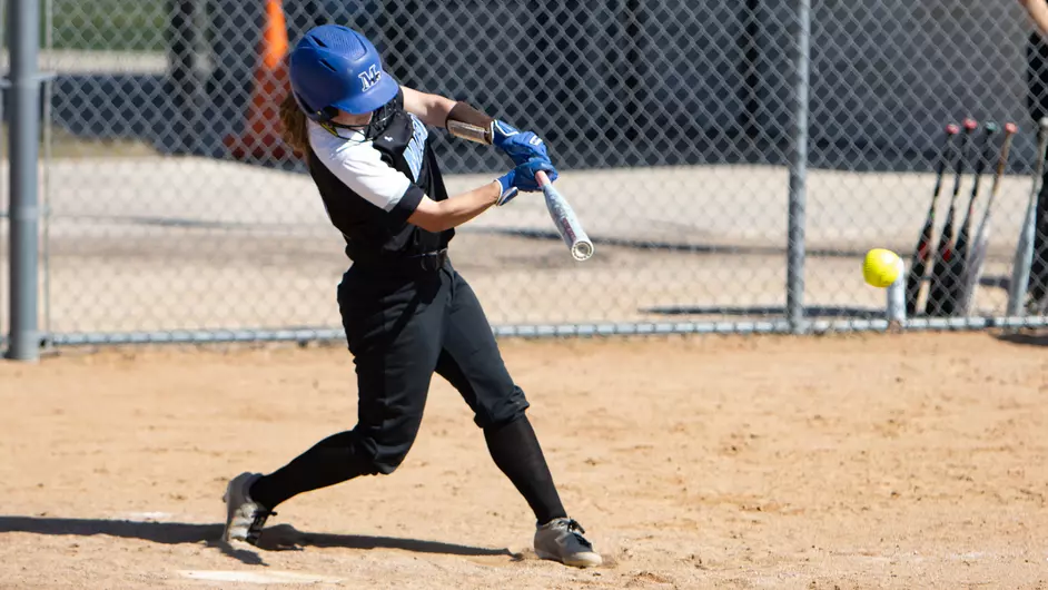 A woman playing college softball