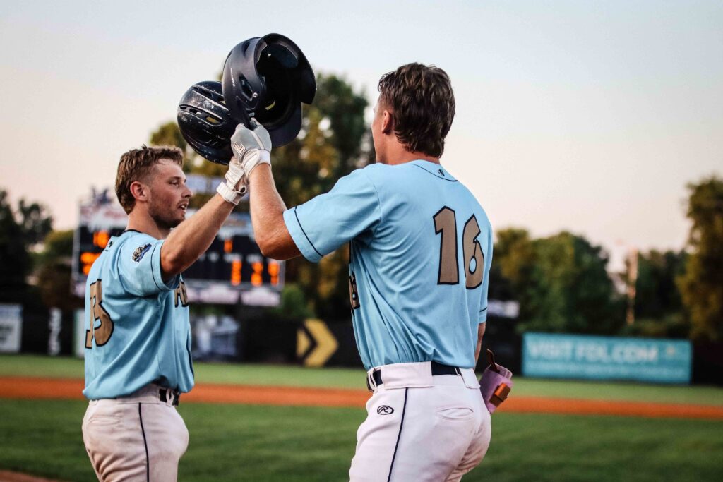 Two baseball players high fiving