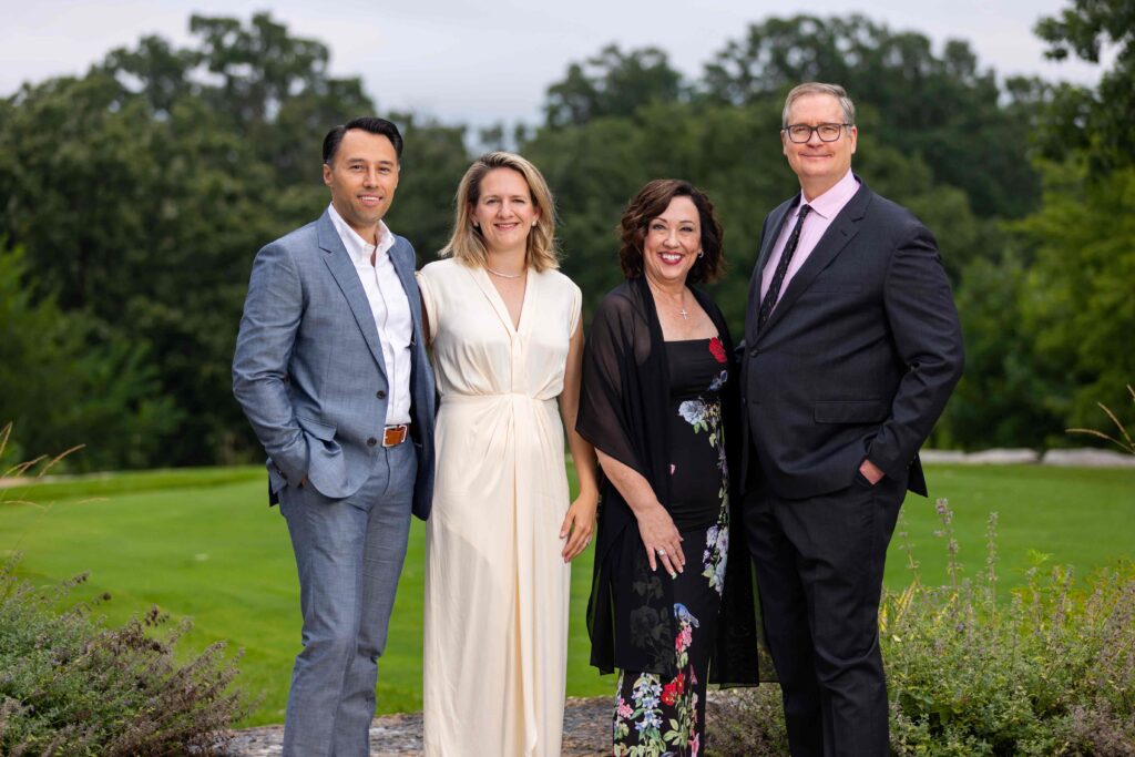 Four people dressed up outside